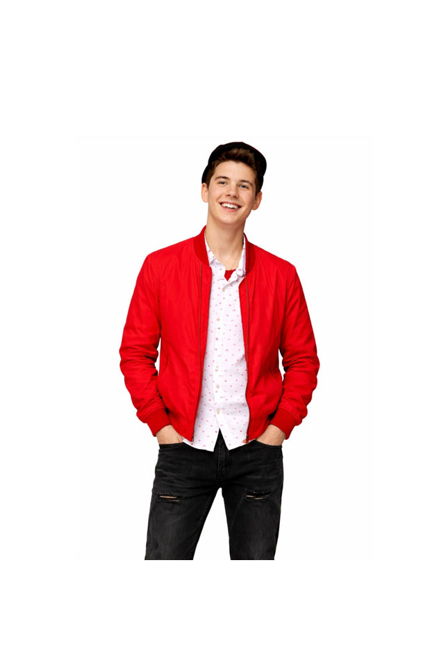 Person wearing a red jacket over a white shirt with black pants on a white background