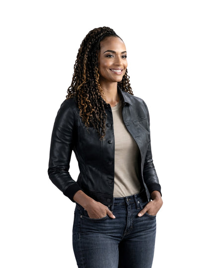 Woman wearing a black leather jacket and jeans on a white background