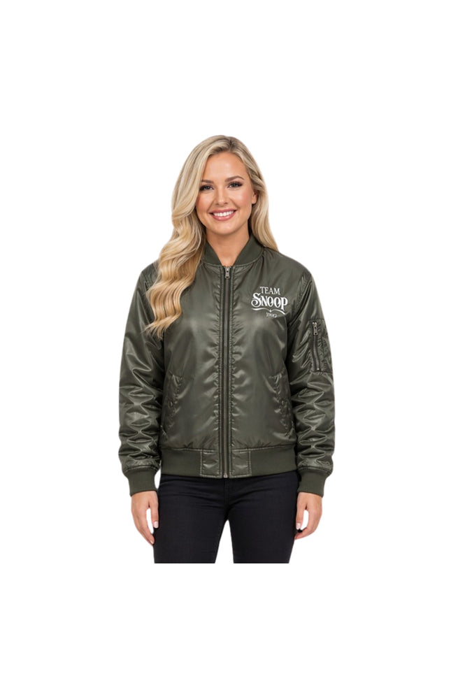 Woman wearing a green bomber jacket with 'Team Snoop' text on a white background