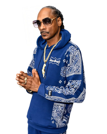 Person wearing a blue hoodie with white patterns on a white background
