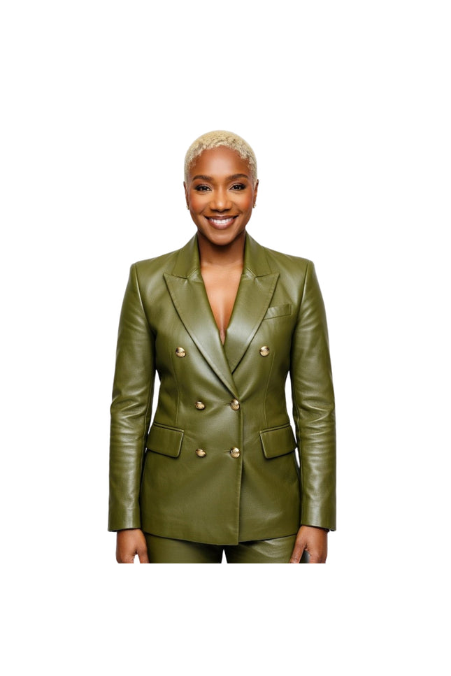 Woman wearing a green leather suit with gold buttons on a white background
