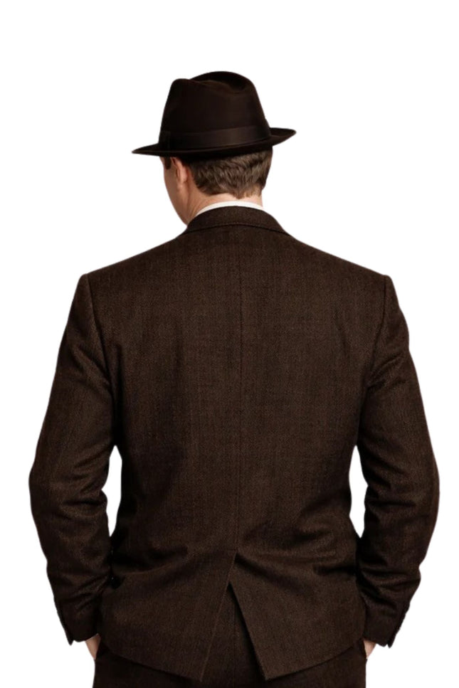 Man wearing a brown suit and hat from behind on a white background