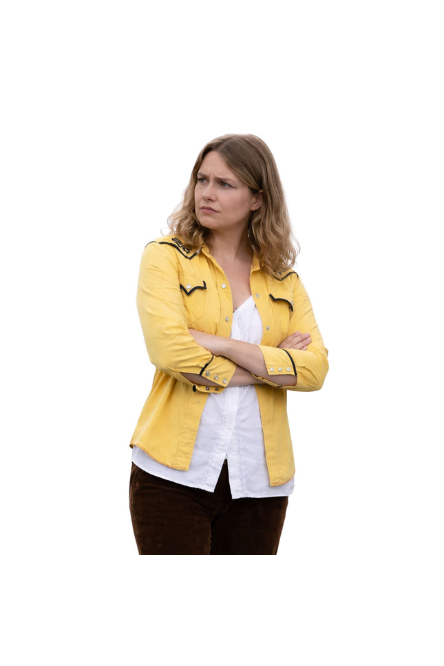 Woman wearing a yellow jacket with black accents on a white background