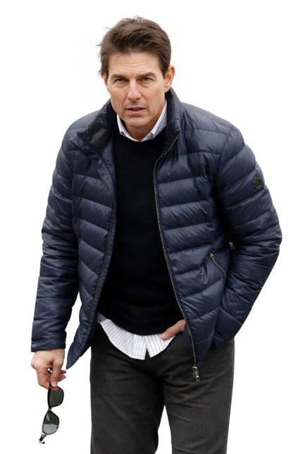 Man wearing a blue puffer jacket on a white background