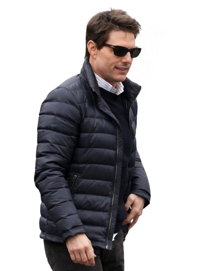 Man wearing a black puffer jacket and sunglasses on a white background