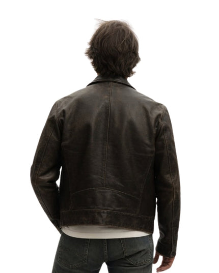 Person wearing a dark brown leather jacket on a white background