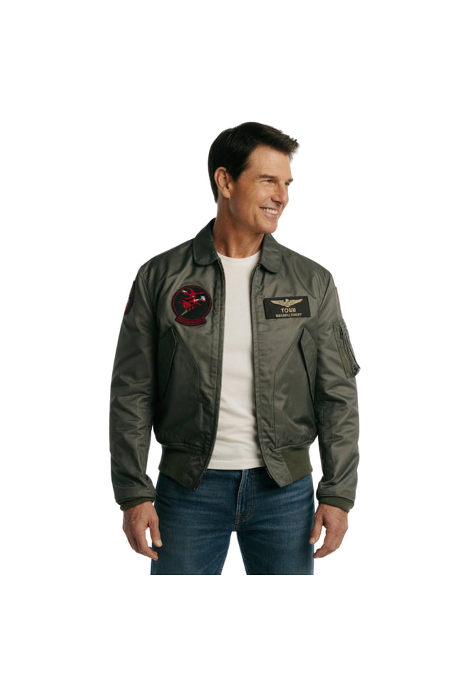 Man wearing a green flight jacket with patches on a white background