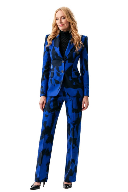 Woman wearing a blue patterned suit on a white background