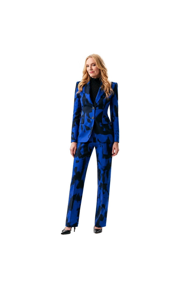 Woman wearing a blue patterned suit on a white background