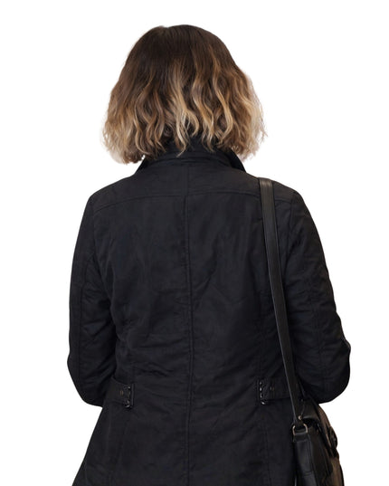 Person wearing a black coat with a white background