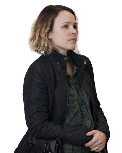 Woman wearing a black jacket on a white background