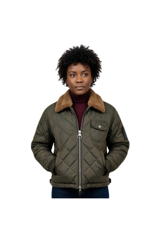 Person wearing a green quilted jacket with a brown fur collar on a white background