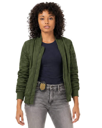 Woman wearing a green jacket, black shirt, and gray jeans on a white background