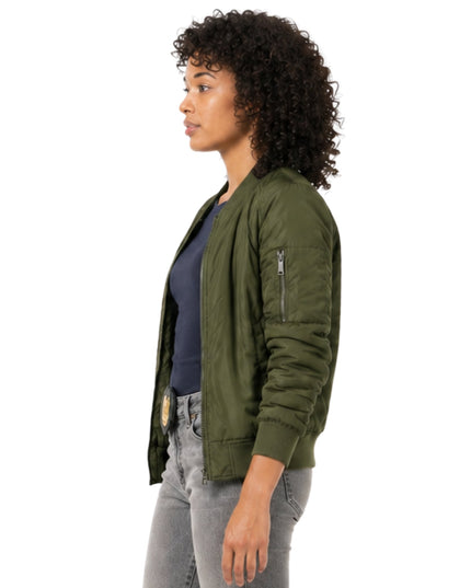 Woman wearing a green bomber jacket on a white background