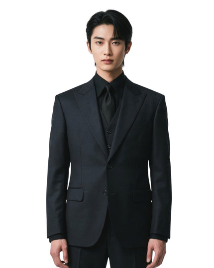 Man wearing a black suit on a white background