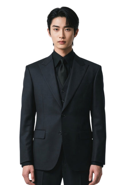 Man wearing a black suit on a white background