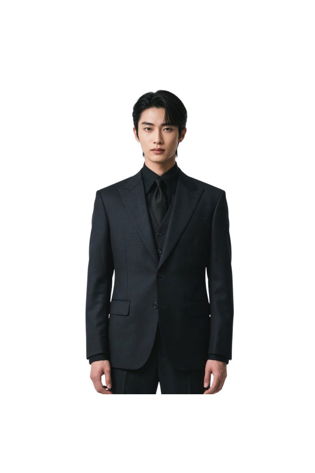 Man wearing a black suit on a white background