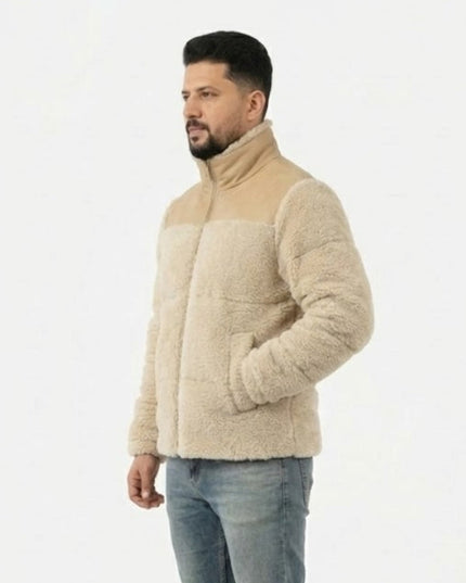 Man wearing a beige fleece jacket on a white background