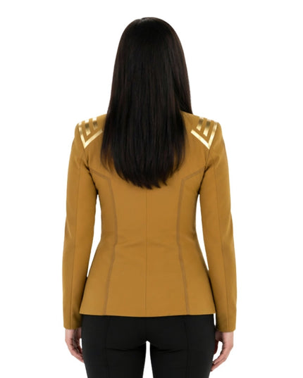 Person wearing a mustard yellow jacket with gold accents on a white background