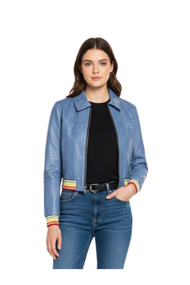 Woman wearing a blue jacket with colorful cuffs and jeans on a white background