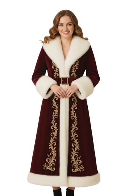 Woman wearing a long, ornate coat with white fur trim on a white background