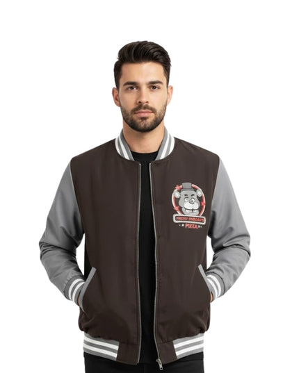 Man wearing a black and gray varsity jacket with a logo on a white background