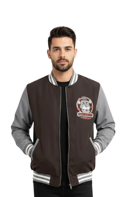 Man wearing a black and gray varsity jacket with a logo on a white background