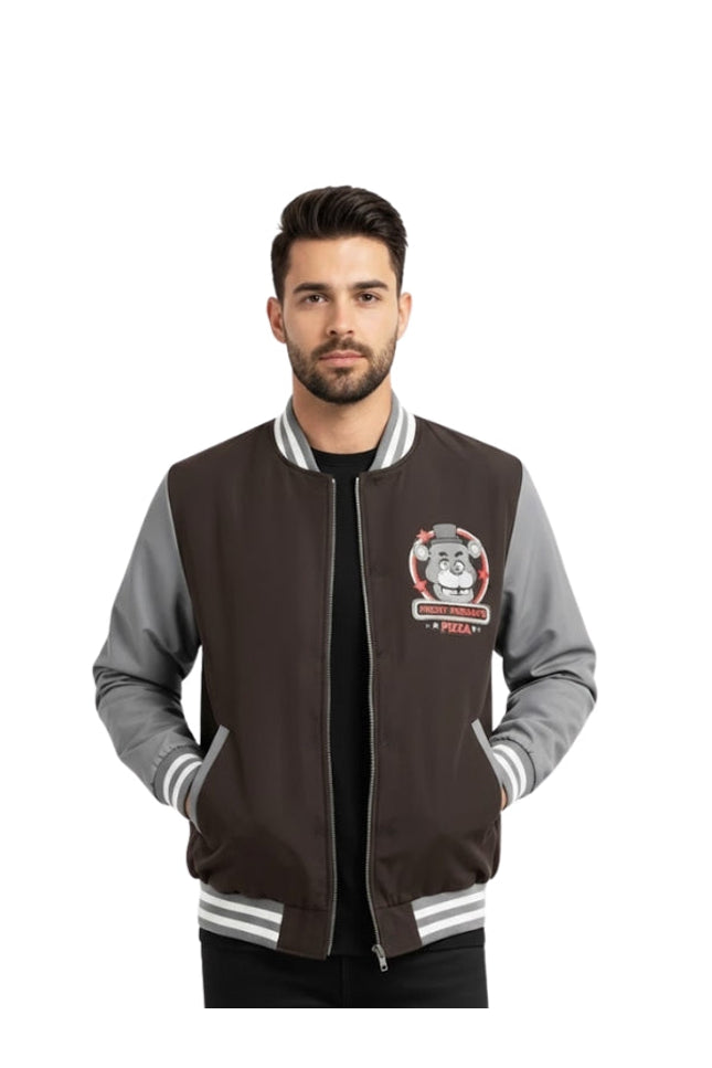 Man wearing a black and gray varsity jacket with a logo on a white background