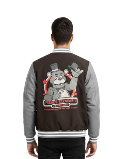 Person wearing a black and gray jacket with a graphic design on the back, on a white background