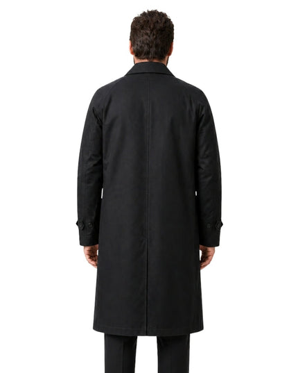 Man wearing a black coat from behind on a white background