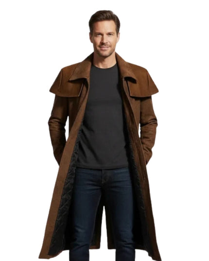 Man wearing a long brown coat over a black shirt on a white background