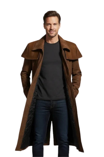Man wearing a long brown coat over a black shirt on a white background