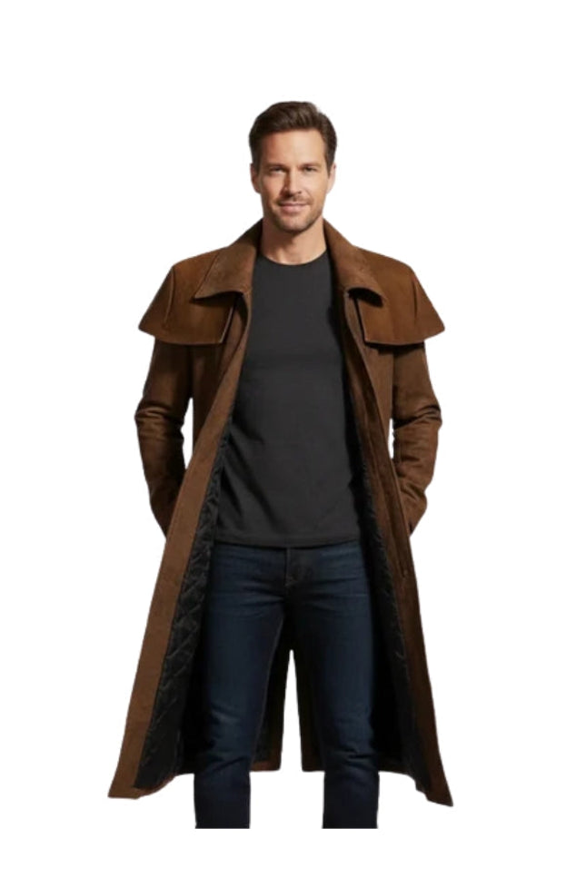 Man wearing a long brown coat over a black shirt on a white background