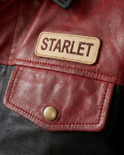Close-up of a red leather jacket with 'STARLET' label