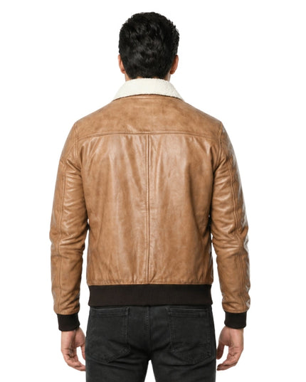Man wearing a tan leather jacket with a white collar on a white background