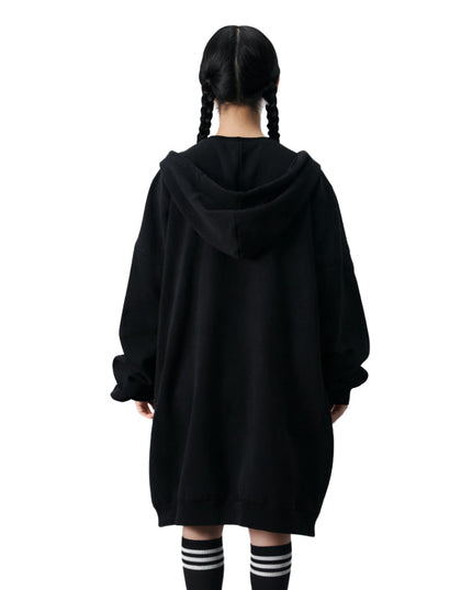 Person wearing a black hoodie from behind on a white background