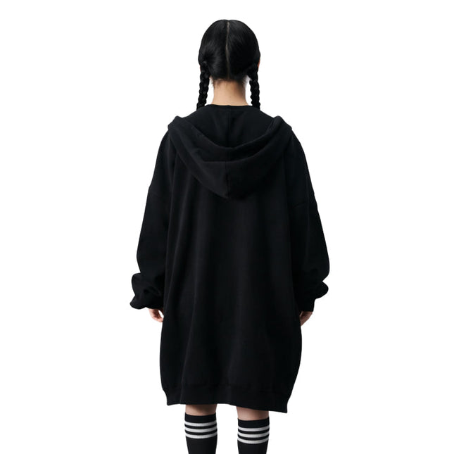 Person wearing a black hoodie from behind on a white background