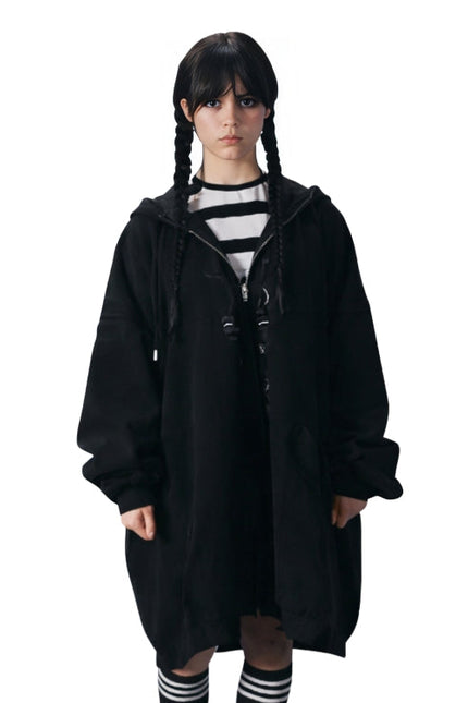 Person wearing a black hooded coat on a white background