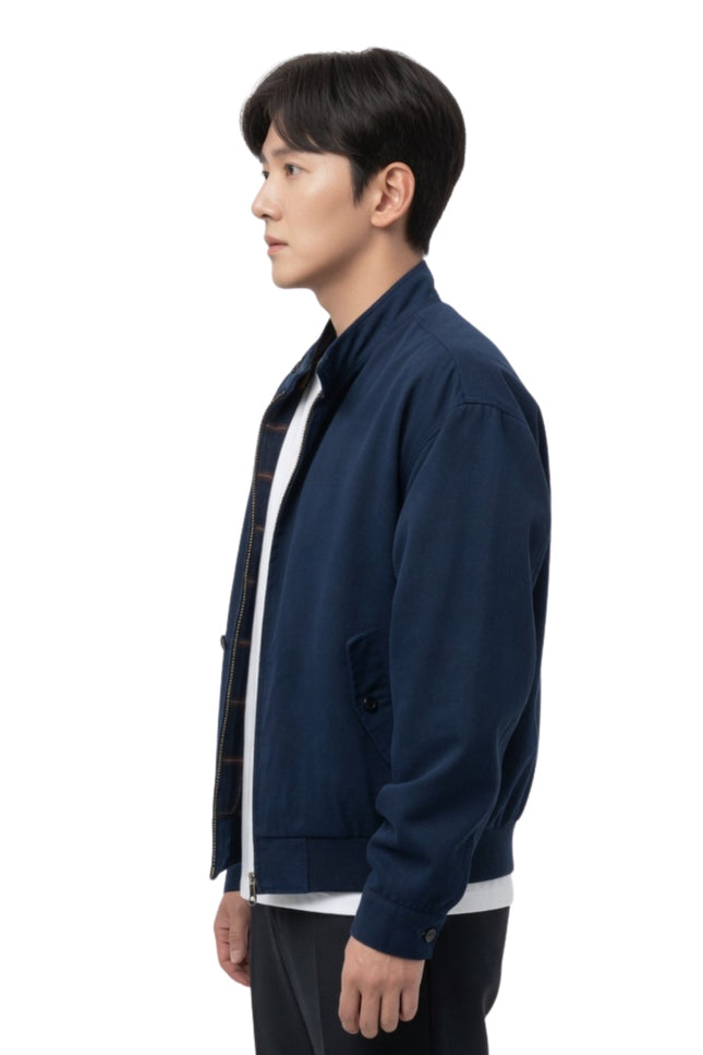 Person wearing a navy blue jacket on a white background