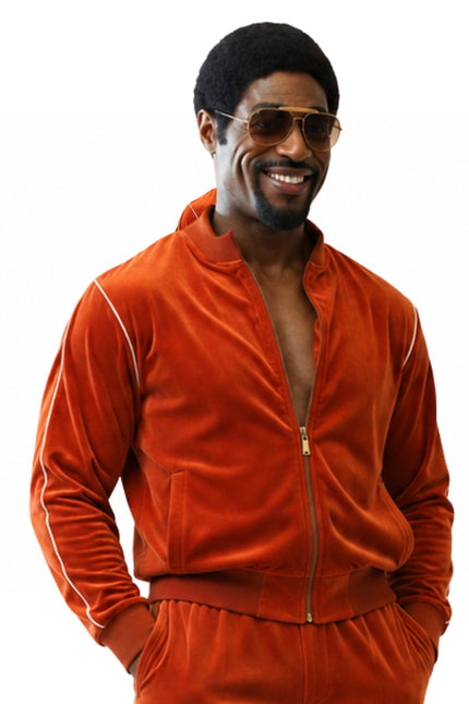 Man wearing an orange tracksuit with a white background