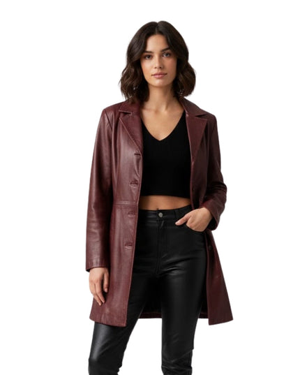 Woman wearing a burgundy leather coat on a white background