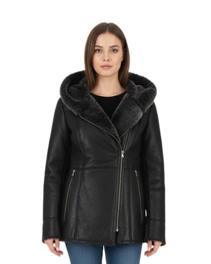 Woman wearing a black leather jacket with fur collar on a white background