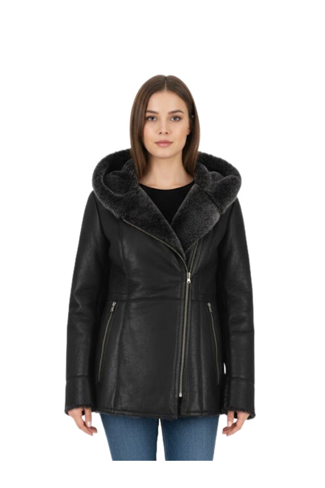 Woman wearing a black leather jacket with fur collar on a white background