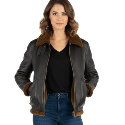 Woman wearing a black leather jacket with brown fur trim on a white background