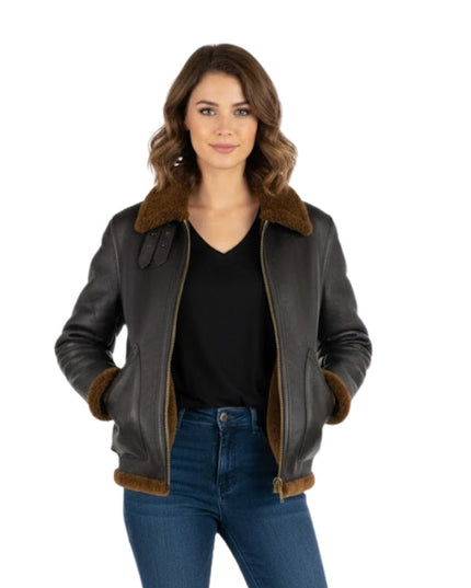 Woman wearing a black leather jacket with brown fur trim on a white background