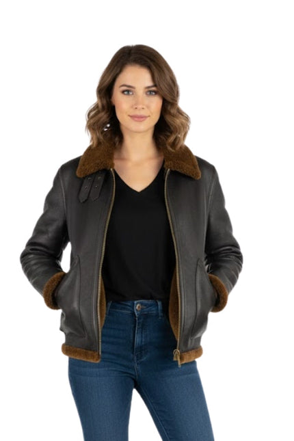 Woman wearing a black leather jacket with brown fur trim on a white background
