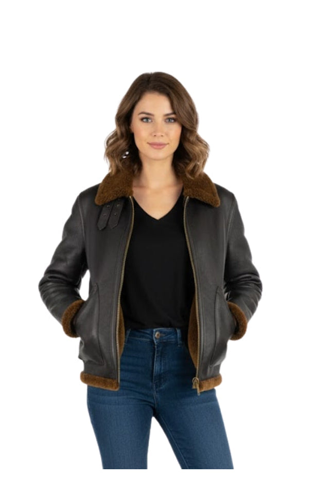 Woman wearing a black leather jacket with brown fur trim on a white background