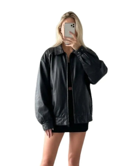 Women’s black 90s style bomber jacket with a classic fit and vintage-inspired look.