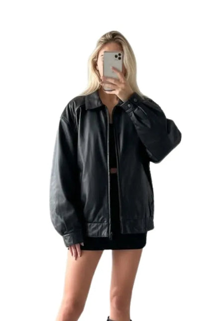 Women’s black 90s style bomber jacket with a classic fit and vintage-inspired look.