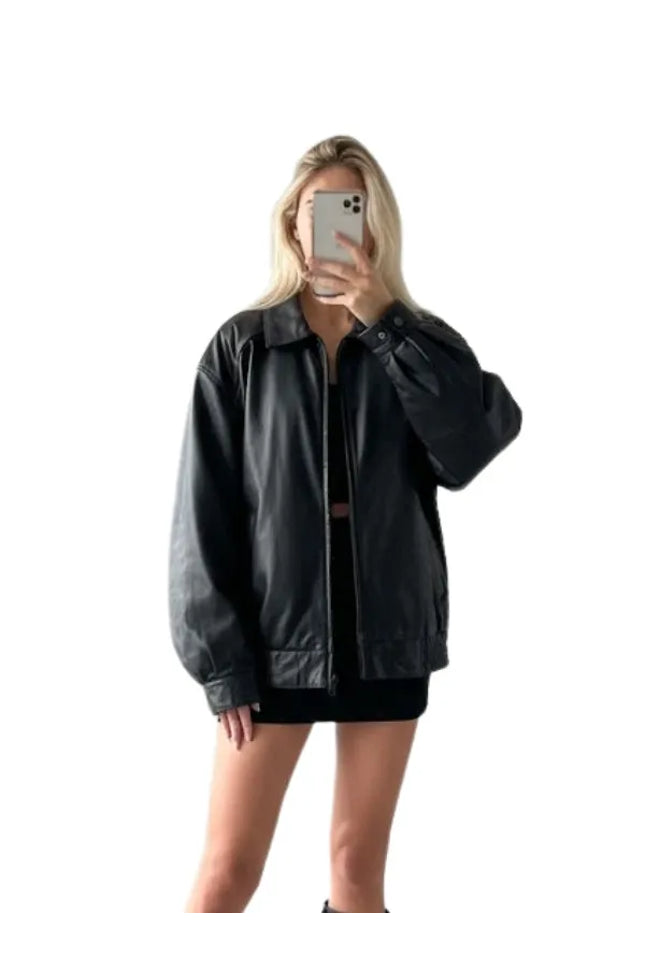 Women’s black 90s style bomber jacket with a classic fit and vintage-inspired look.
